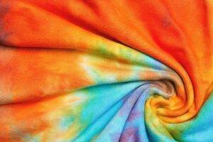 Abstract tie dye multicolor twisted knitted fabric cloth Boho pattern texture for background