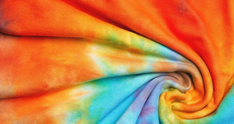 Abstract tie dye multicolor twisted knitted fabric cloth Boho pattern texture for background